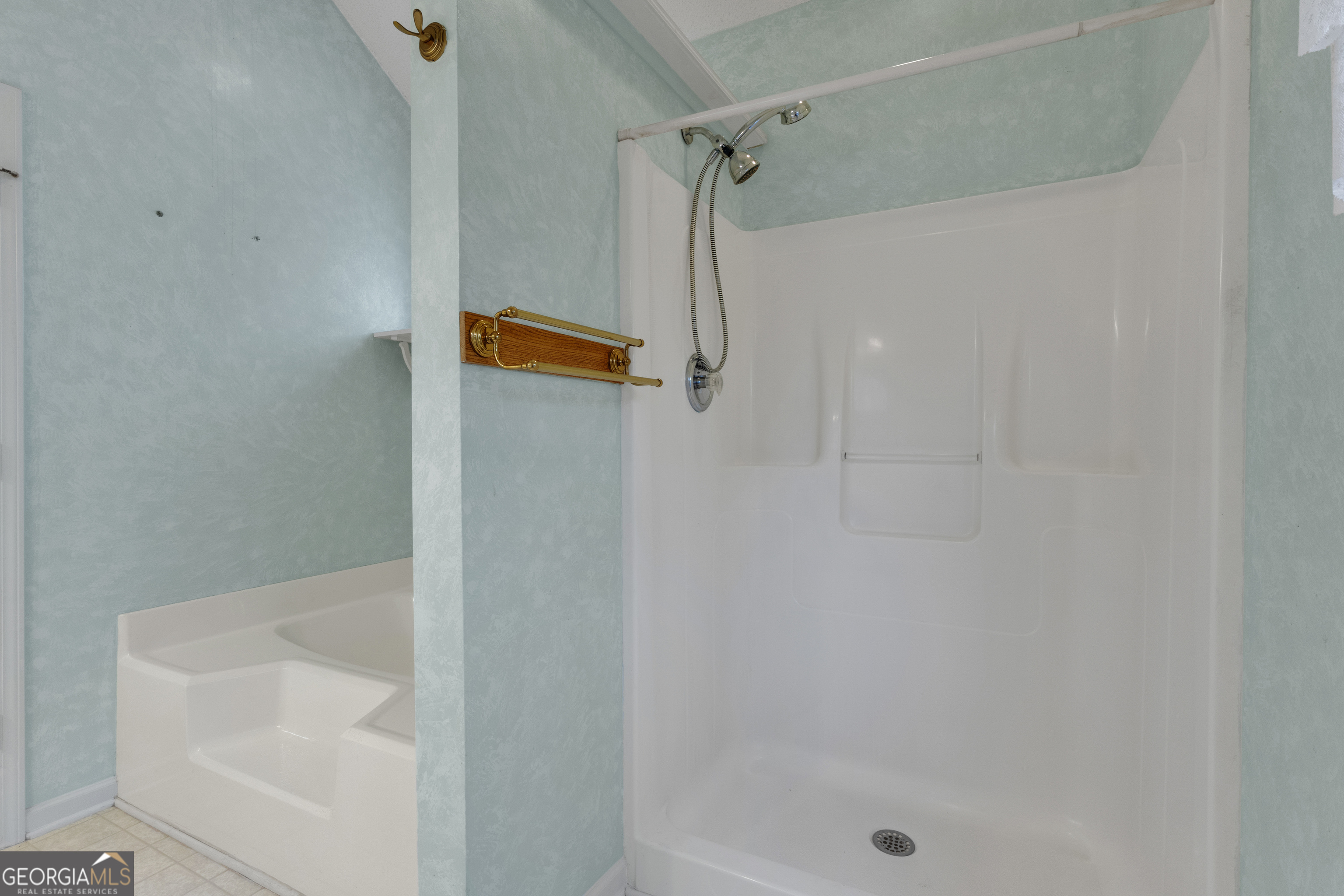 165 Masters Drive Newnan, GA 30265 - Photo 37 of 63 a bathroom with a shower