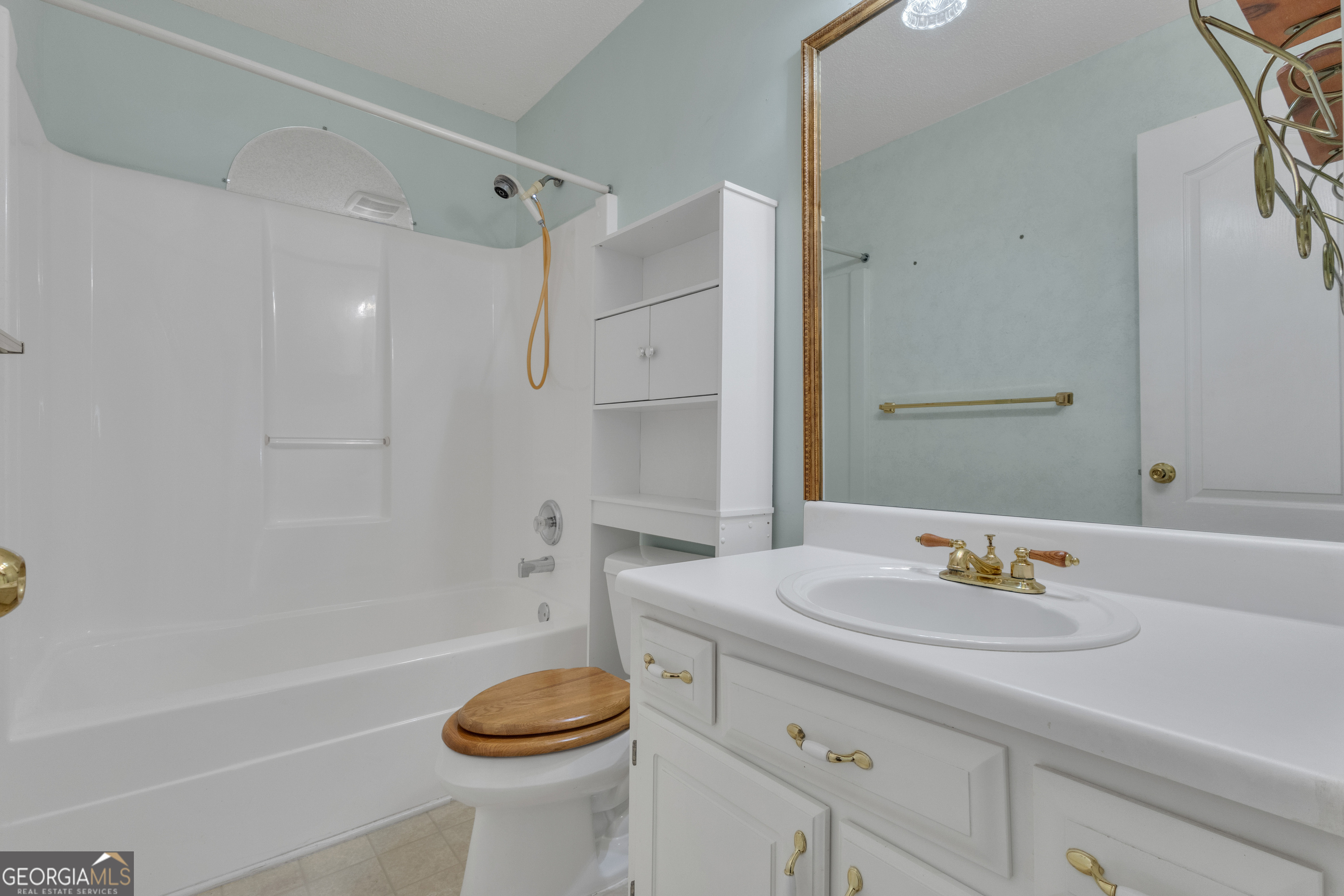 165 Masters Drive Newnan, GA 30265 - Photo 41 of 63 a bathroom with a sink a toilet and shower