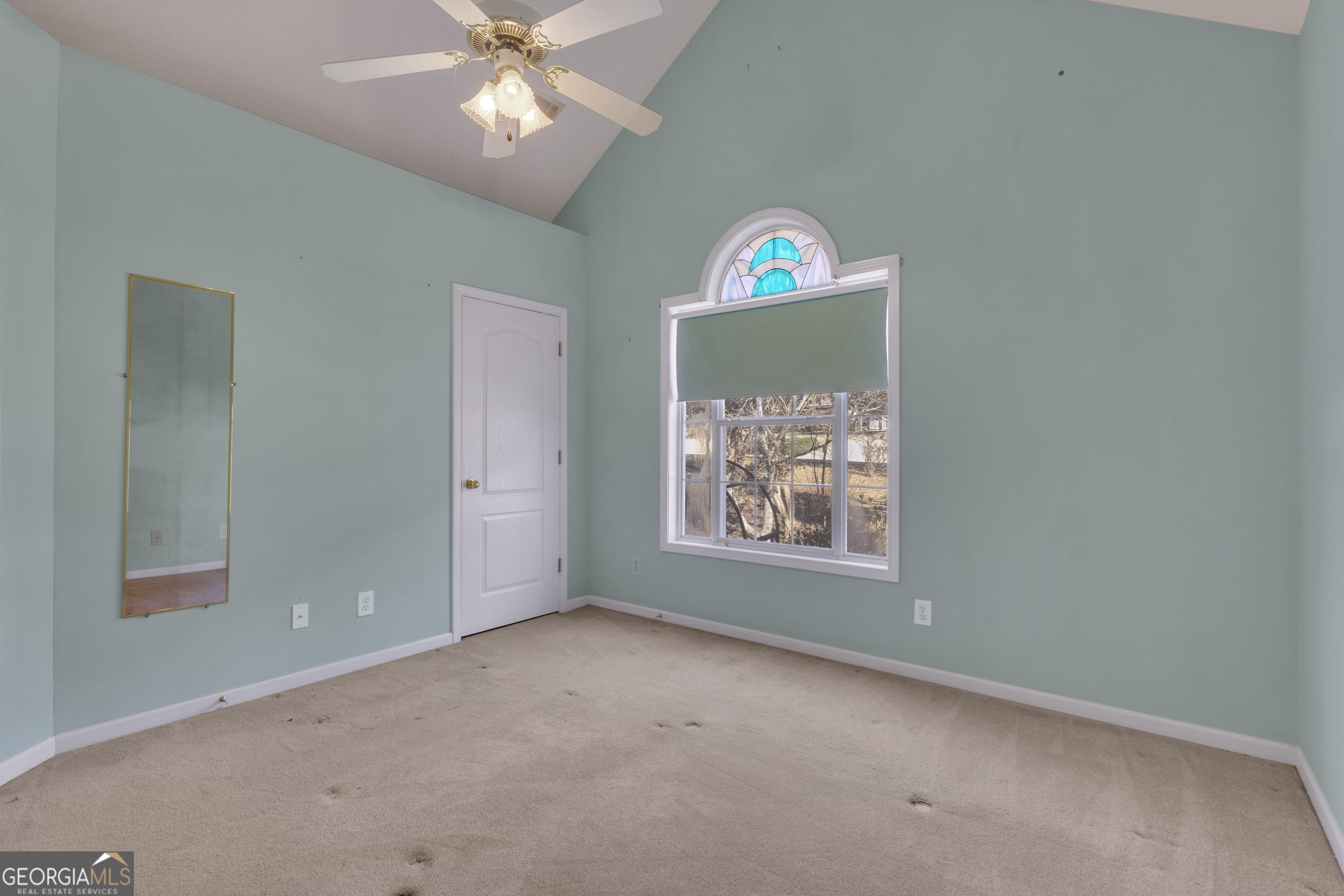 165 Masters Drive Newnan, GA 30265 - Photo 43 of 63 an empty room with windows and fan