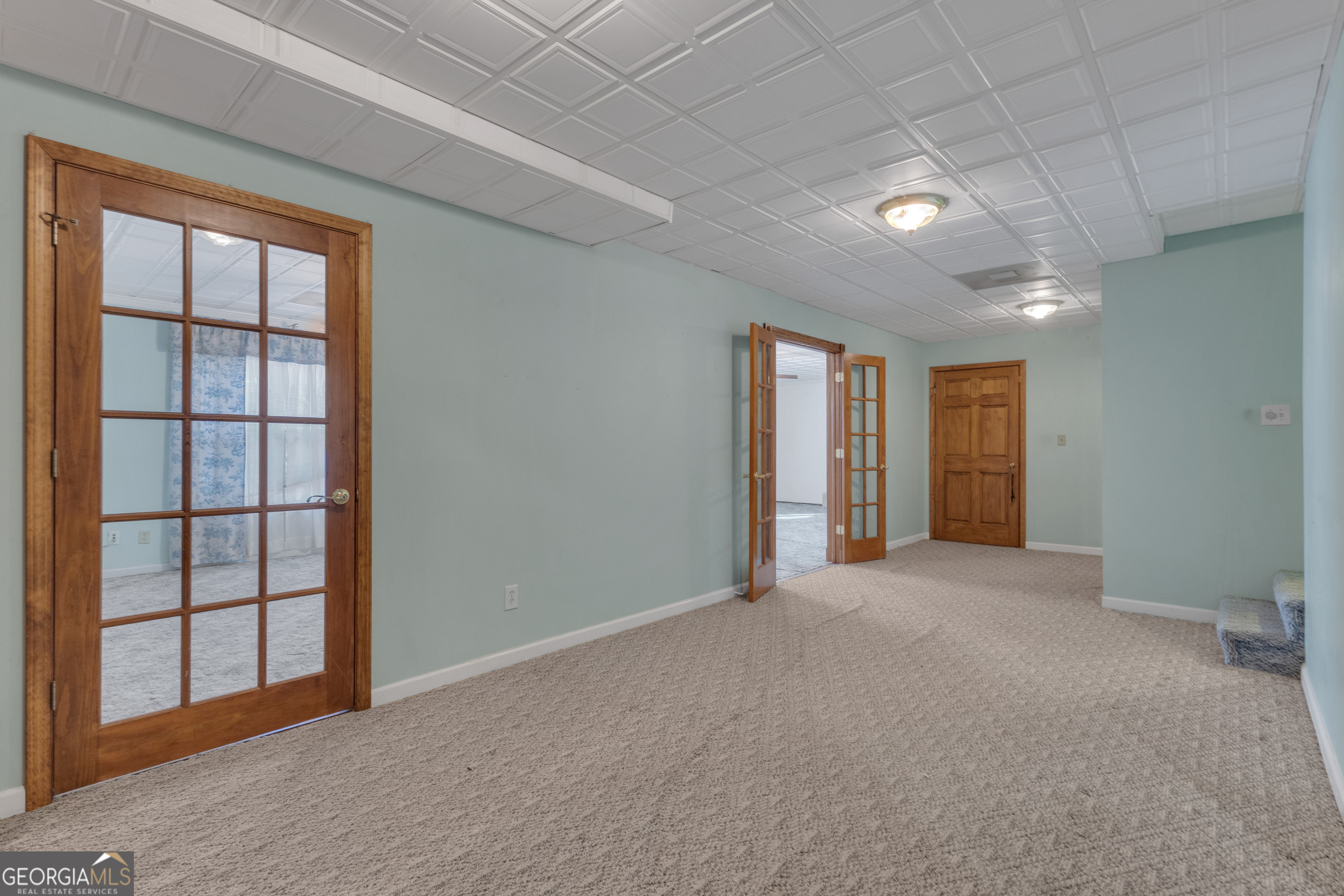 165 Masters Drive Newnan, GA 30265 - Photo 49 of 63 an empty room with windows and closet