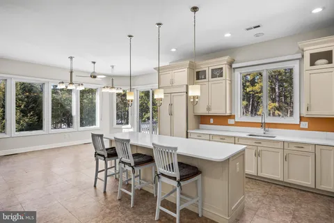 a view of balcony with wooden floor and fence