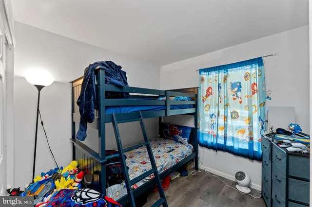 a bathroom with a sink toilet vanity and tub