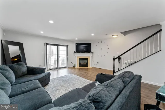 a living room with furniture window and a couch