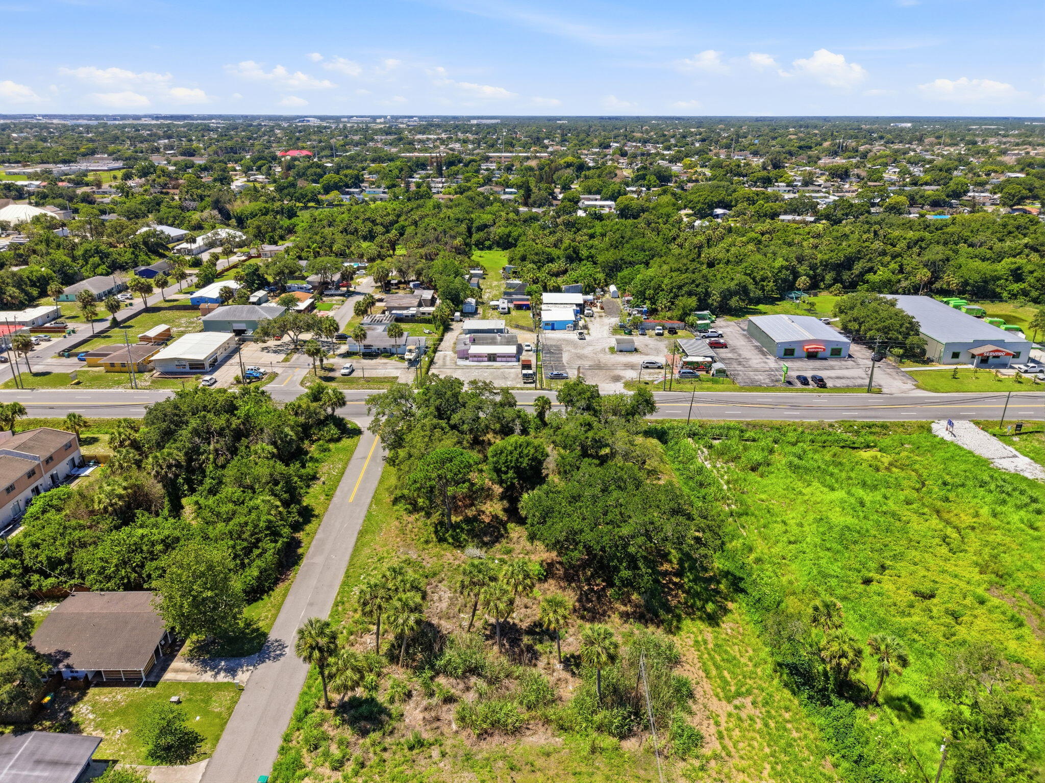 0 Aurora Road Melbourne, FL 32935 - Photo 8 of 20 an aerial view of residential houses with outdoor space and trees