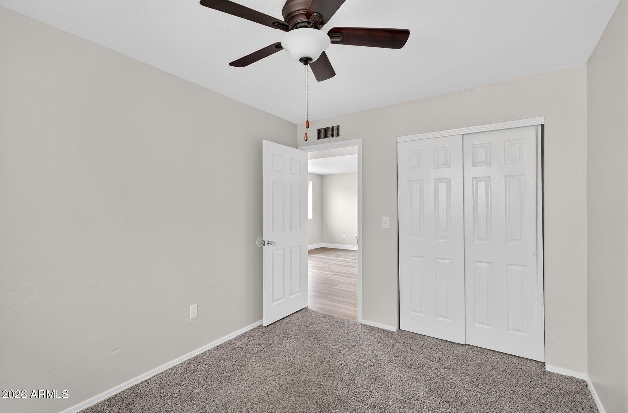 1417 East Mineral Road Gilbert, AZ 85234 - Photo 46 of 59 a view of an empty room and chandelier fan