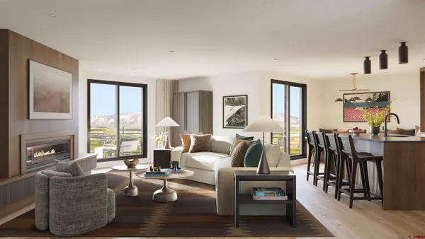 a living room with furniture fireplace and flat screen tv