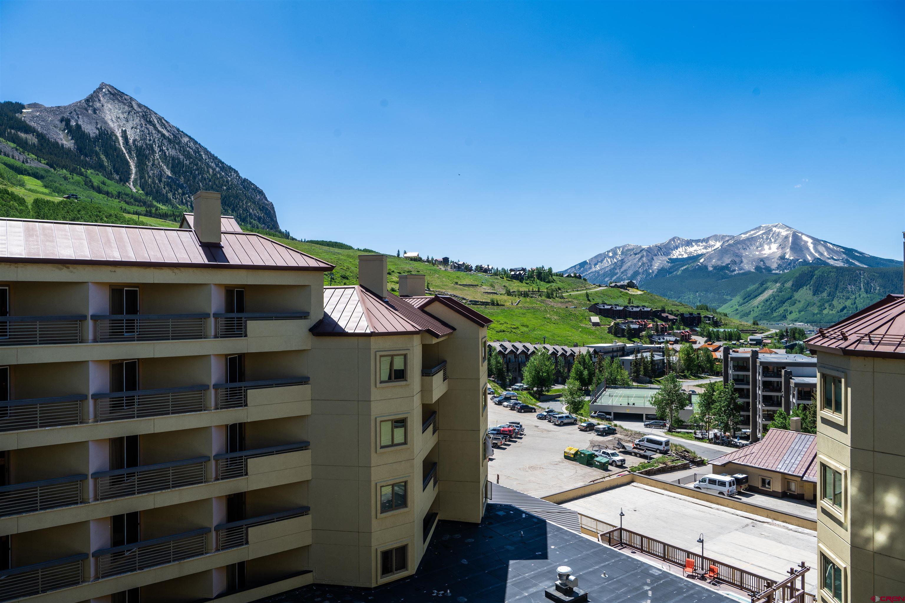 500 Gothic Road, Unit 605 Crested Butte, CO 81225 - Photo 21 of 27 a view of a balcony with couches and wooden floor