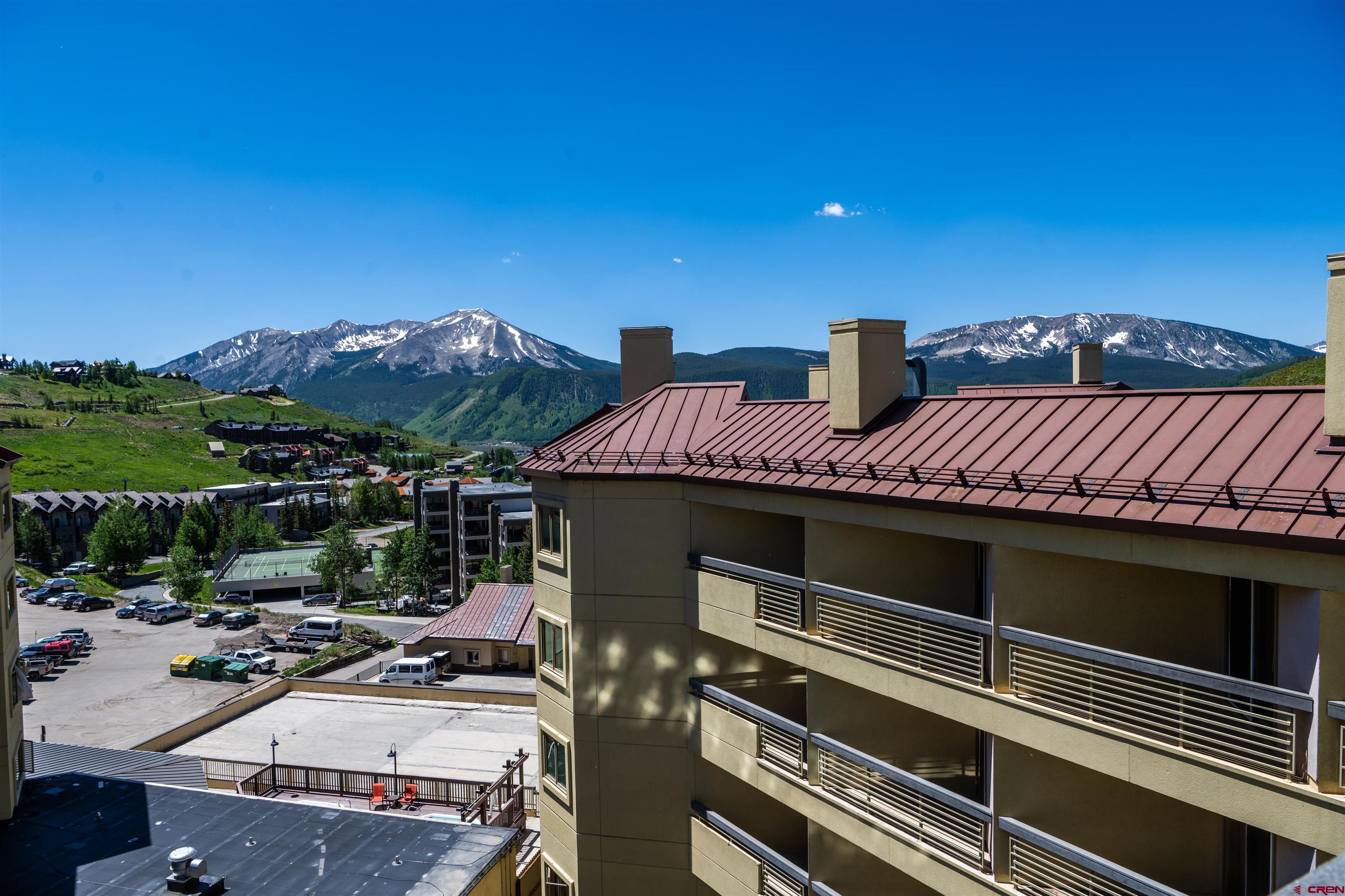 500 Gothic Road, Unit 605 Crested Butte, CO 81225 - Photo 24 of 27 a view of a patio with a table and chairs