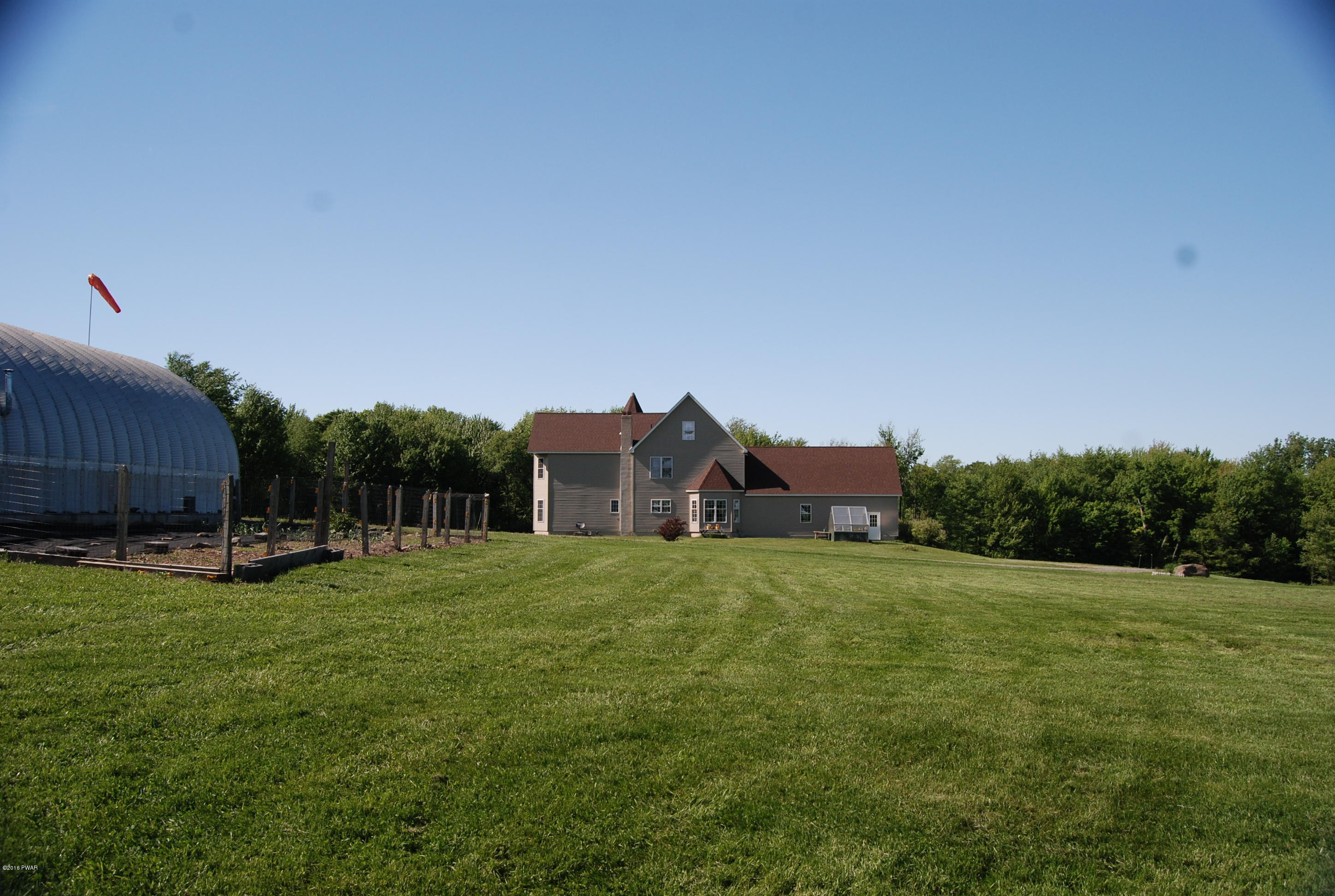176 Highland Road Pleasant Mount, PA 18453 - Photo 47 of 52 a view of a big house with a big yard and large trees