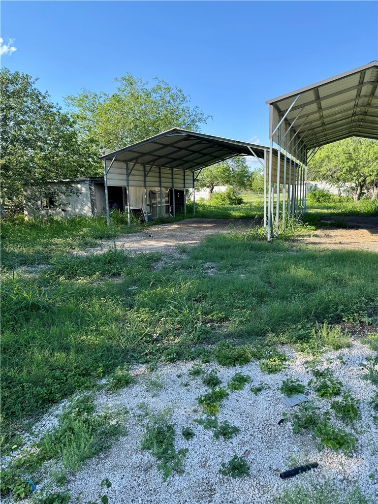24748 County Road 350 Mathis, TX 78368 - Photo 22 of 35 STORAGE/WORKSHOP IS TO THE LEFT OF THE CARPORT.