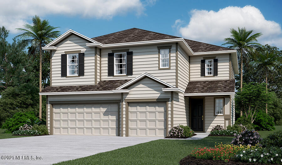 144 Wards Ravine Way St. Johns, FL 32259 - Photo 1 of 3 a front view of a house with a garden and plants