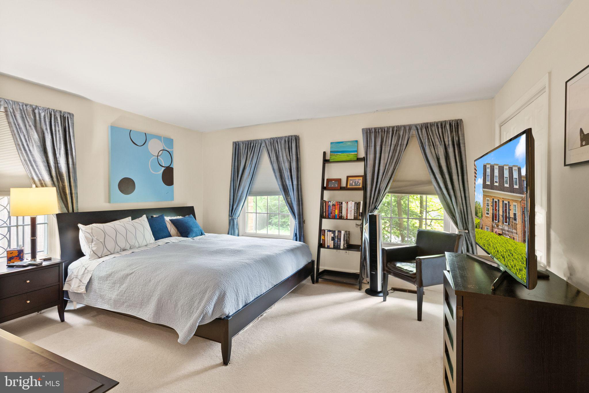 3267 Sutton Place Northwest, Unit C Washington, DC 20016 - Photo 11 of 21 a bedroom with a bed and a large window