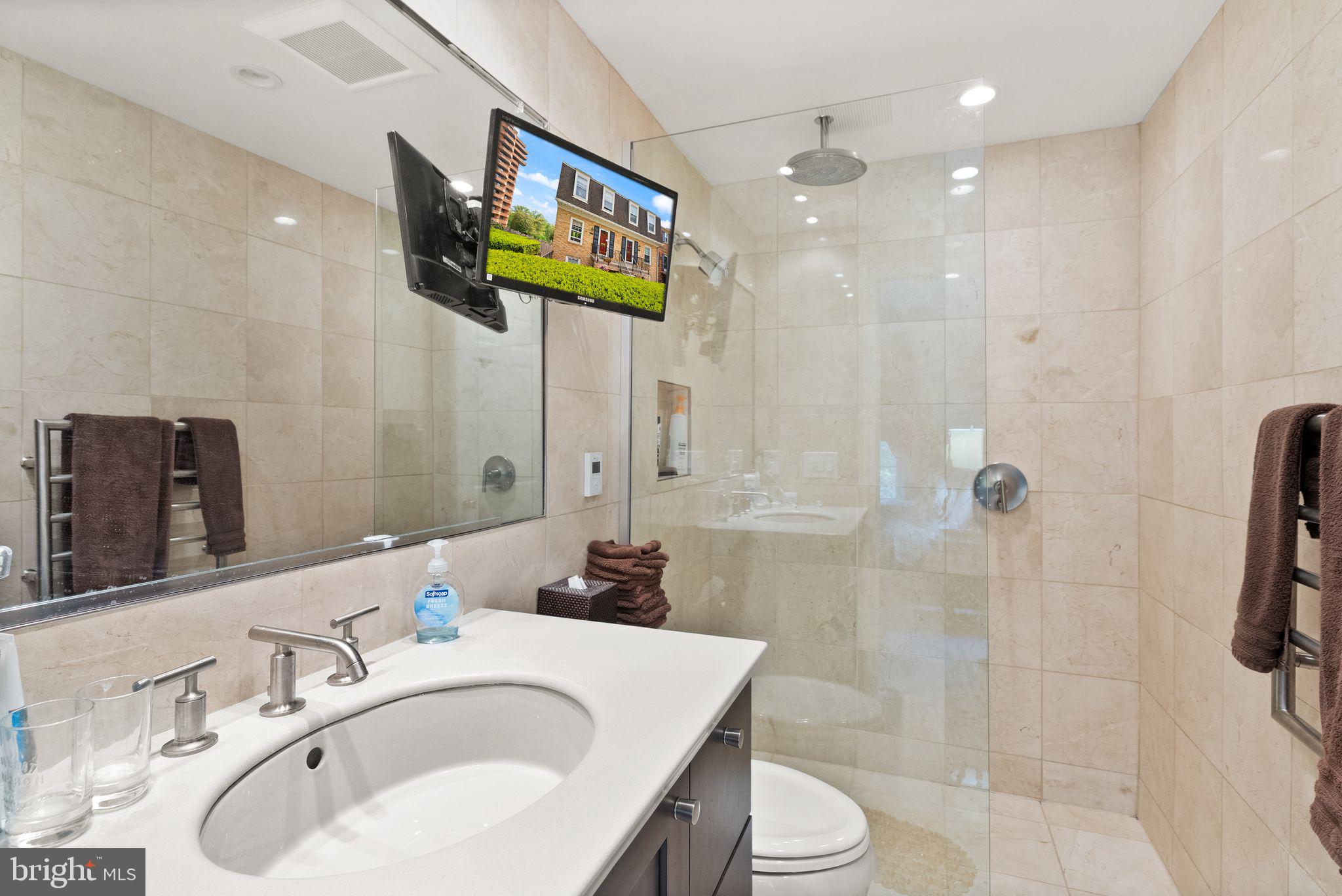 3267 Sutton Place Northwest, Unit C Washington, DC 20016 - Photo 13 of 21 a bathroom with a sink toilet and shower