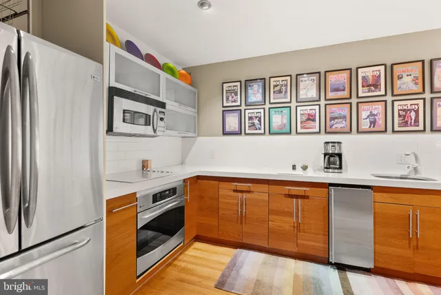 a kitchen with stainless steel appliances granite countertop a stove and a sink