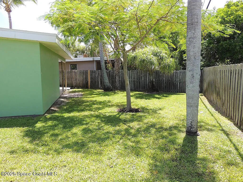 206 4th Avenue Indialantic, FL 32903 - Photo 13 of 43 a swimming pool with wooden fence