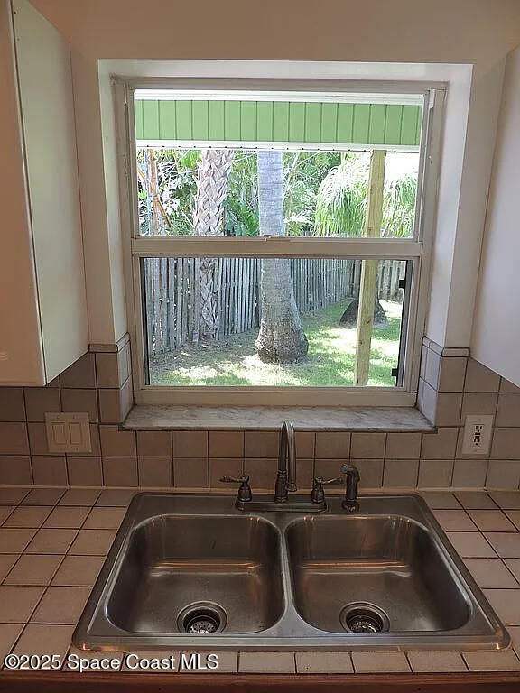 206 4th Avenue Indialantic, FL 32903 - Photo 17 of 43 a bathroom sink with a stove