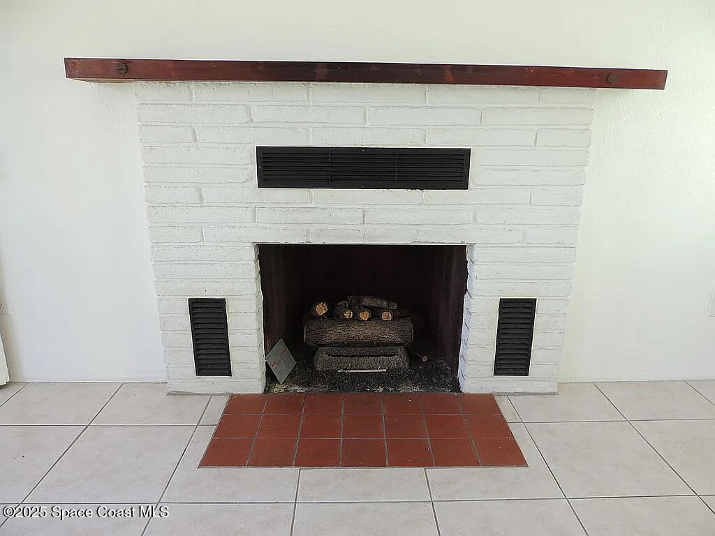 206 4th Avenue Indialantic, FL 32903 - Photo 20 of 43 a living room with a fireplace