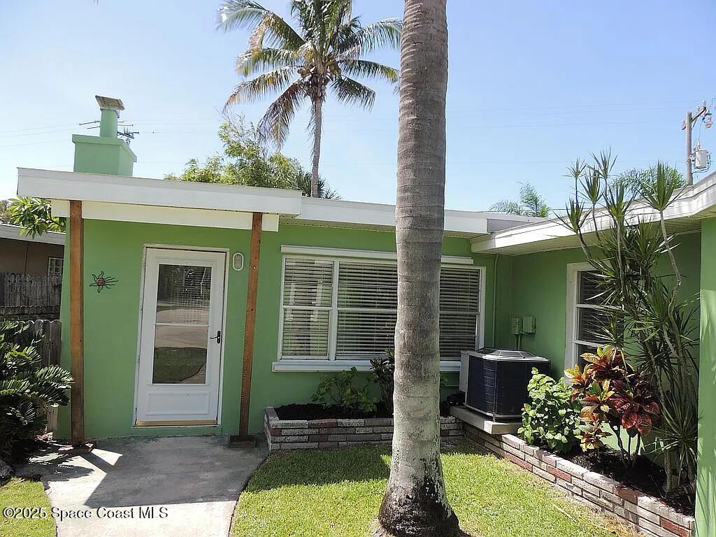 206 4th Avenue Indialantic, FL 32903 - Photo 2 of 43 a front view of a house with a yard