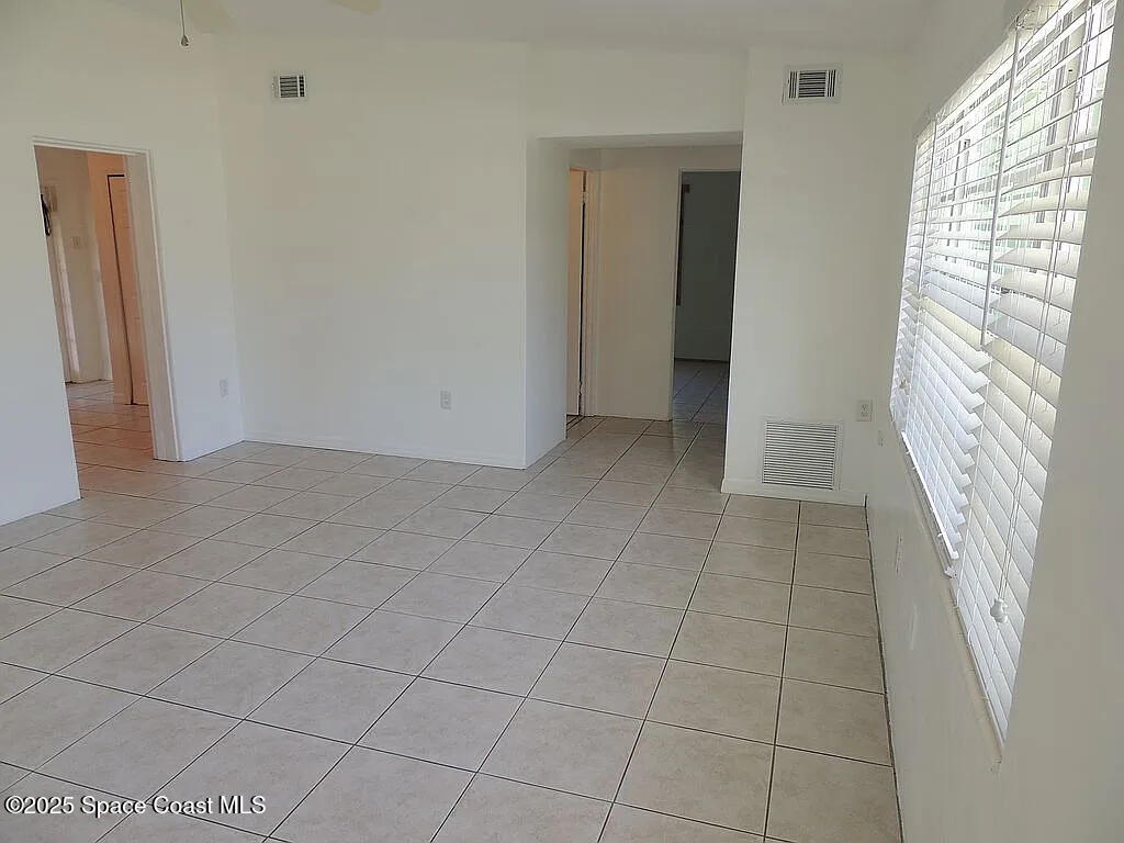 206 4th Avenue Indialantic, FL 32903 - Photo 23 of 43 an empty room with windows