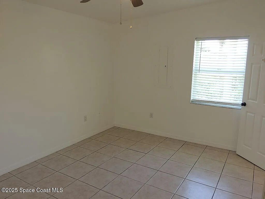 206 4th Avenue Indialantic, FL 32903 - Photo 24 of 43 an empty room with a window