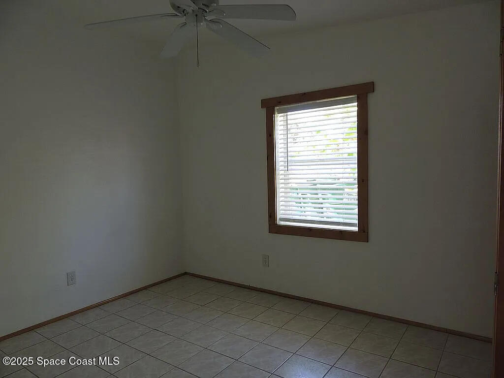 206 4th Avenue Indialantic, FL 32903 - Photo 36 of 43 a view of an empty room with a window
