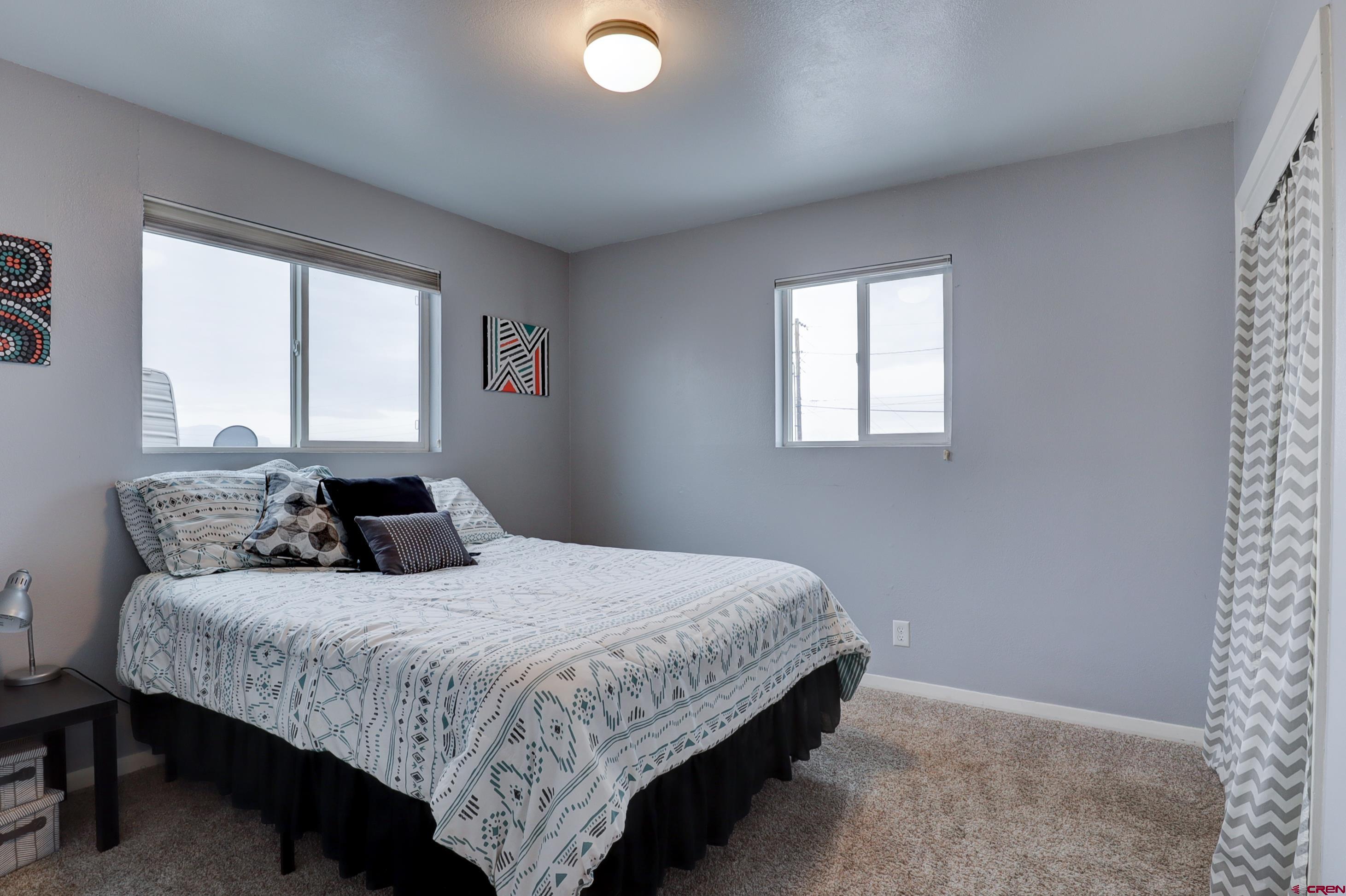 2019 Rolling Road Cortez, CO 81321 - Photo 11 of 35 a bedroom with a bed and window