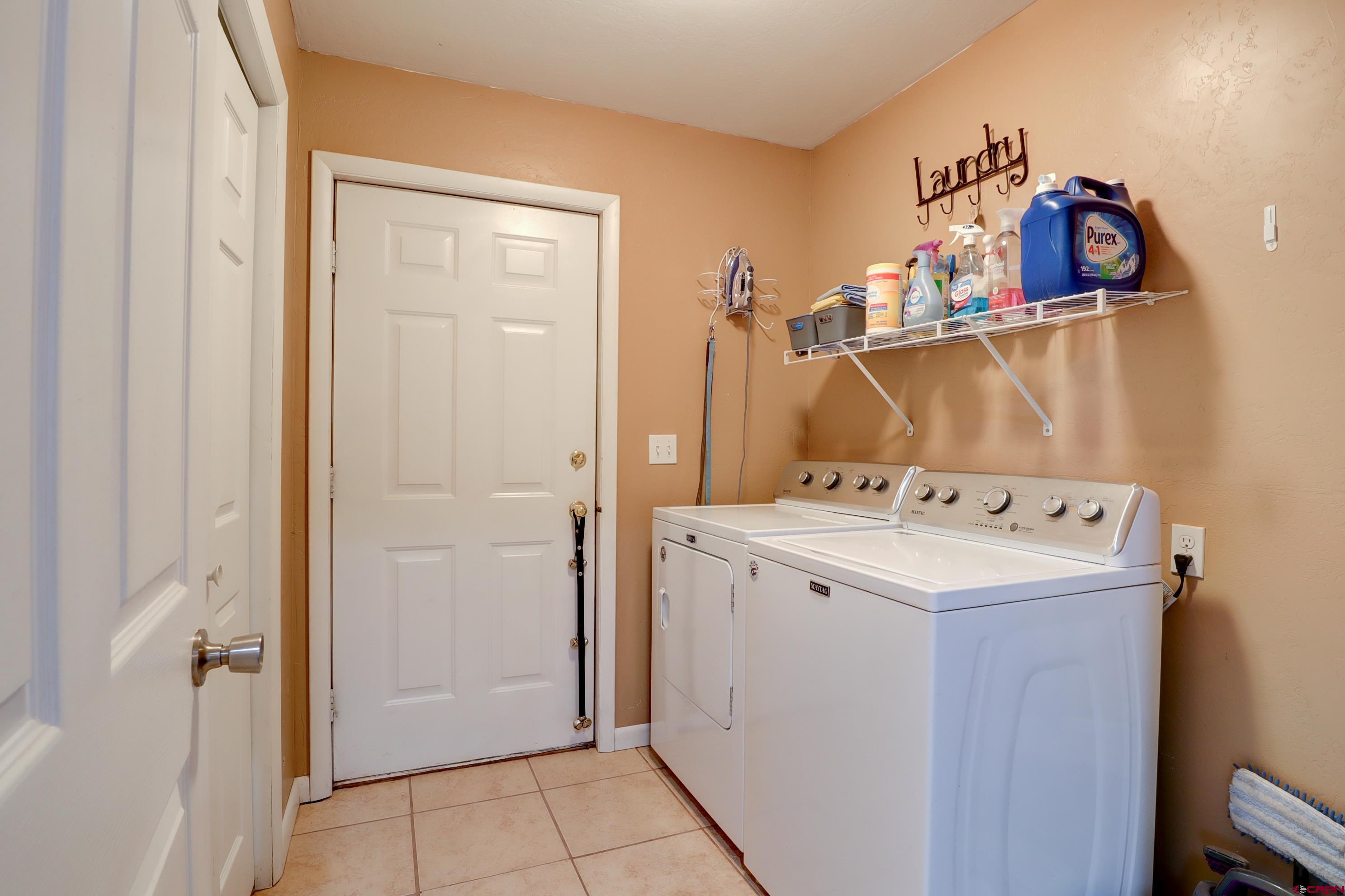2019 Rolling Road Cortez, CO 81321 - Photo 16 of 35 a utility room with dryer and washer