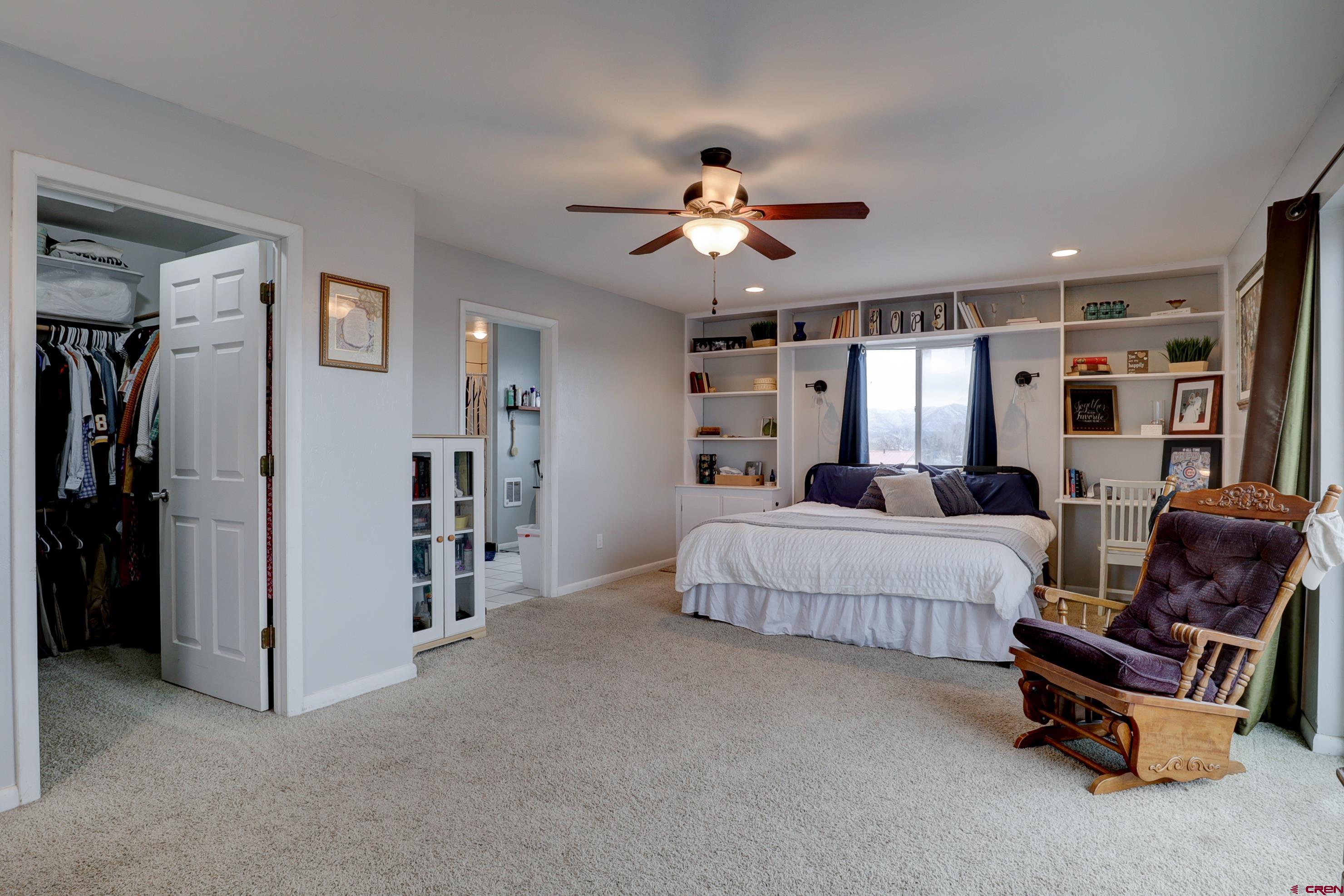 2019 Rolling Road Cortez, CO 81321 - Photo 21 of 35 a living room with furniture and a chandelier