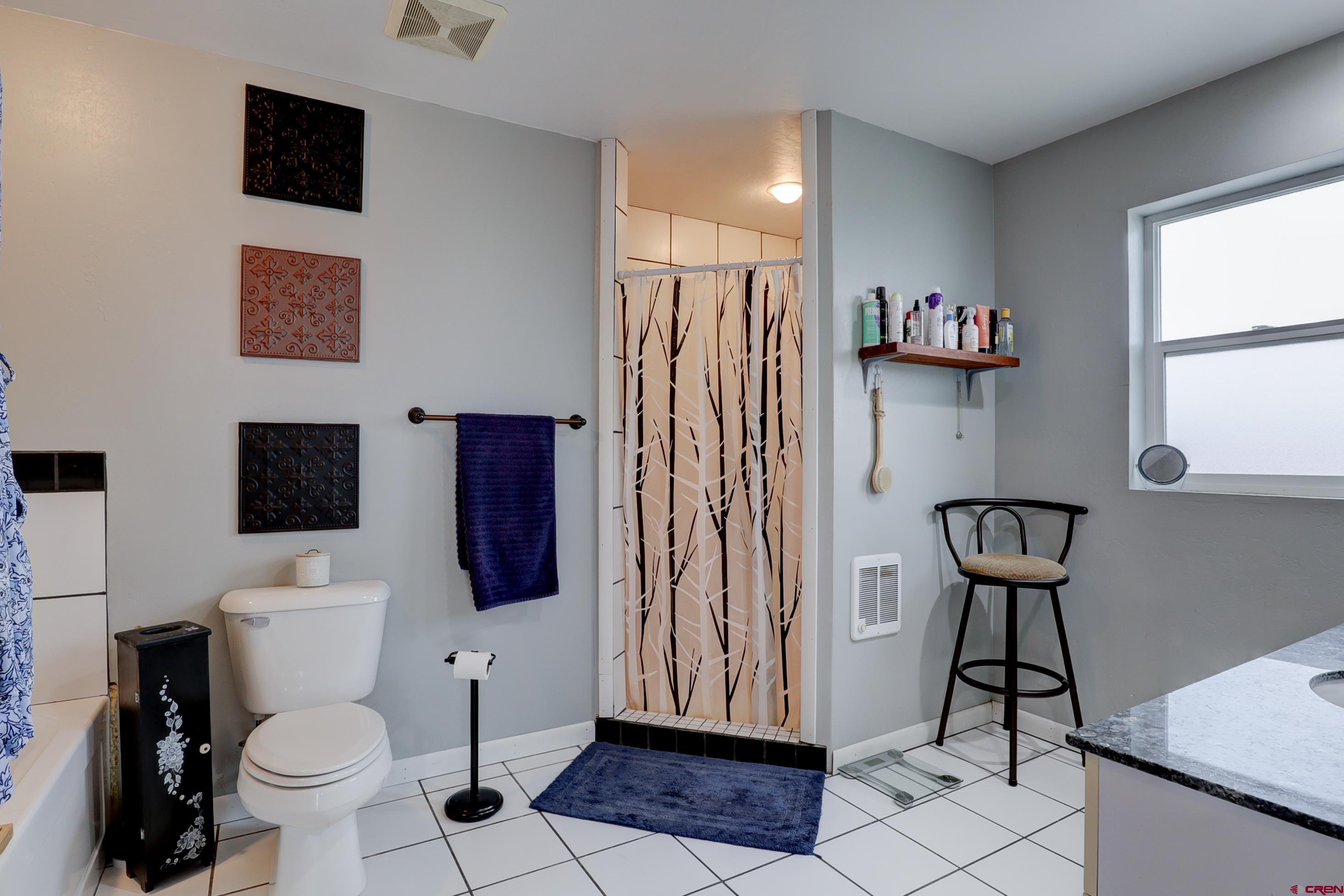 2019 Rolling Road Cortez, CO 81321 - Photo 22 of 35 a bathroom with a toilet and a shower