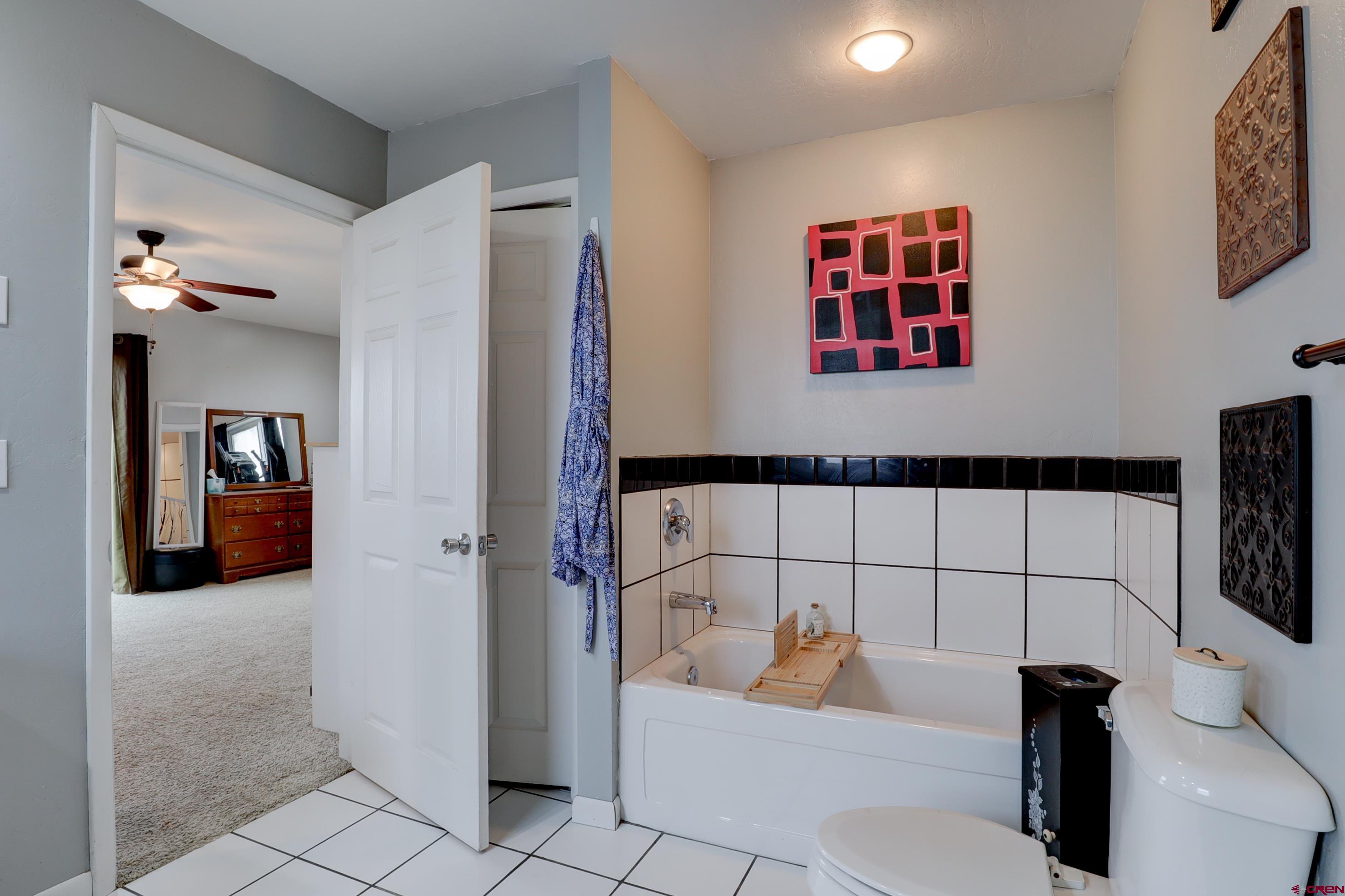 2019 Rolling Road Cortez, CO 81321 - Photo 24 of 35 a bathroom with a bathtub and shower