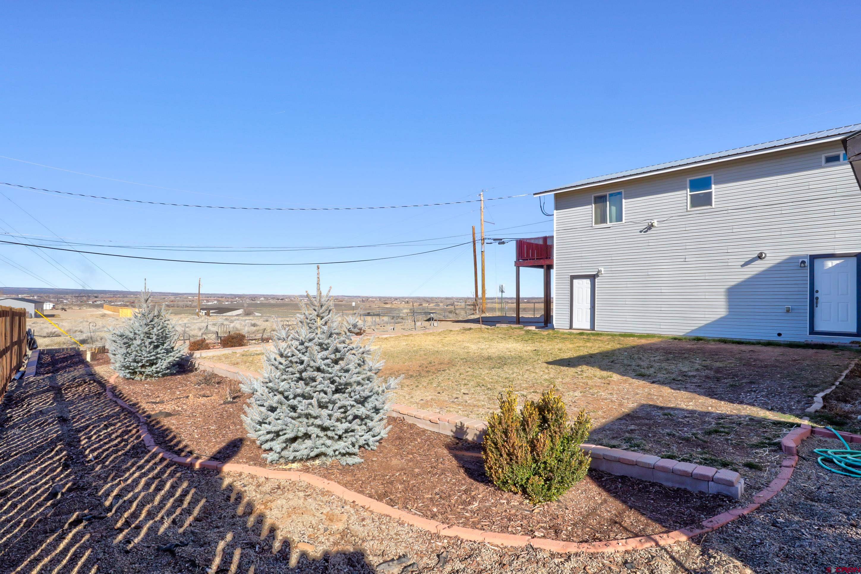 2019 Rolling Road Cortez, CO 81321 - Photo 28 of 35 a view of a backyard of the house