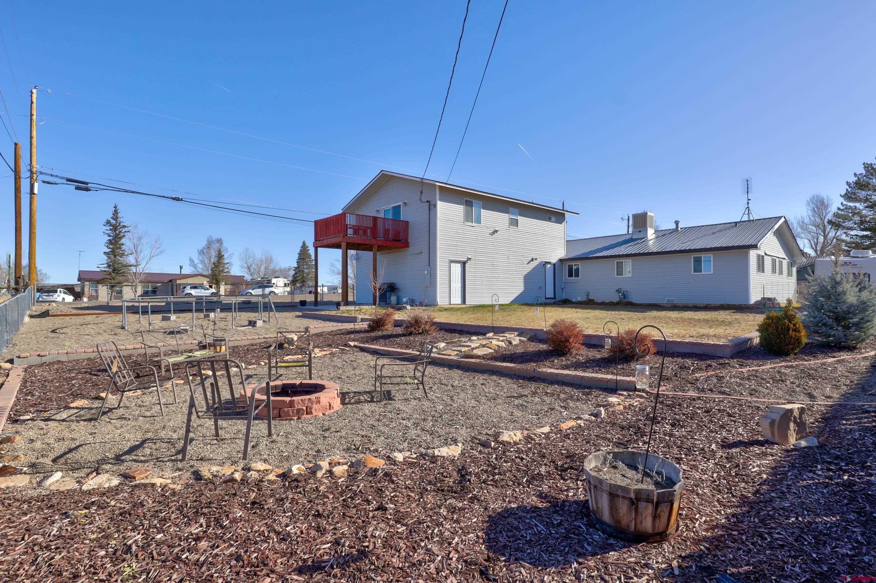 2019 Rolling Road Cortez, CO 81321 - Photo 30 of 35 a view of a chairs and table in backyard