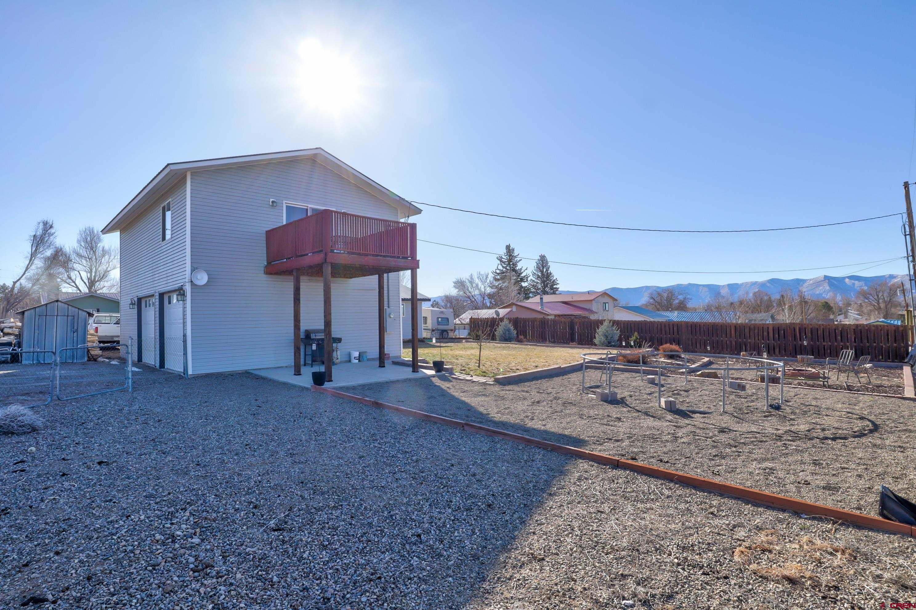 2019 Rolling Road Cortez, CO 81321 - Photo 31 of 35 a view of a house with a backyard