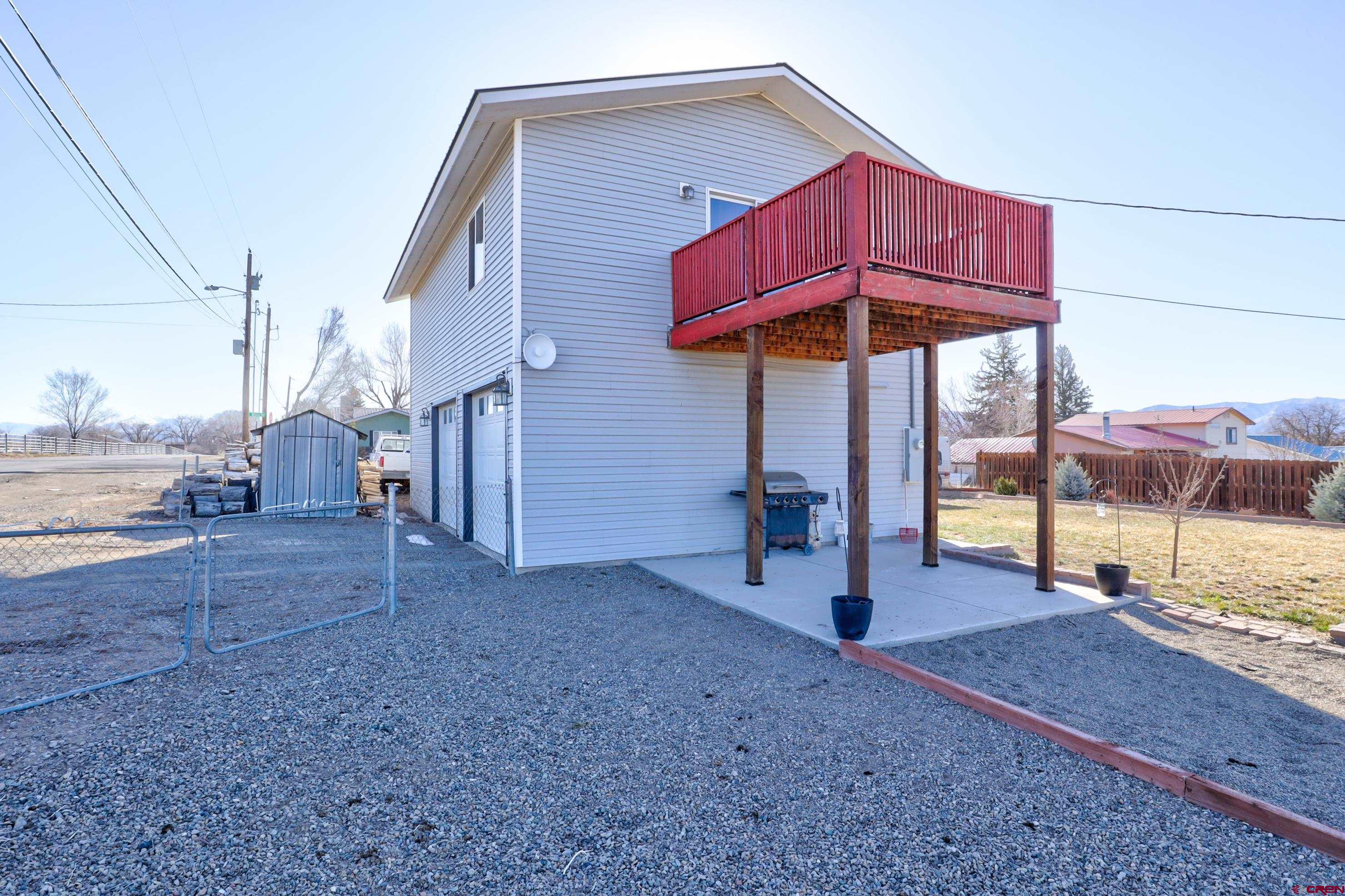 2019 Rolling Road Cortez, CO 81321 - Photo 32 of 35 a view of a house with backyard