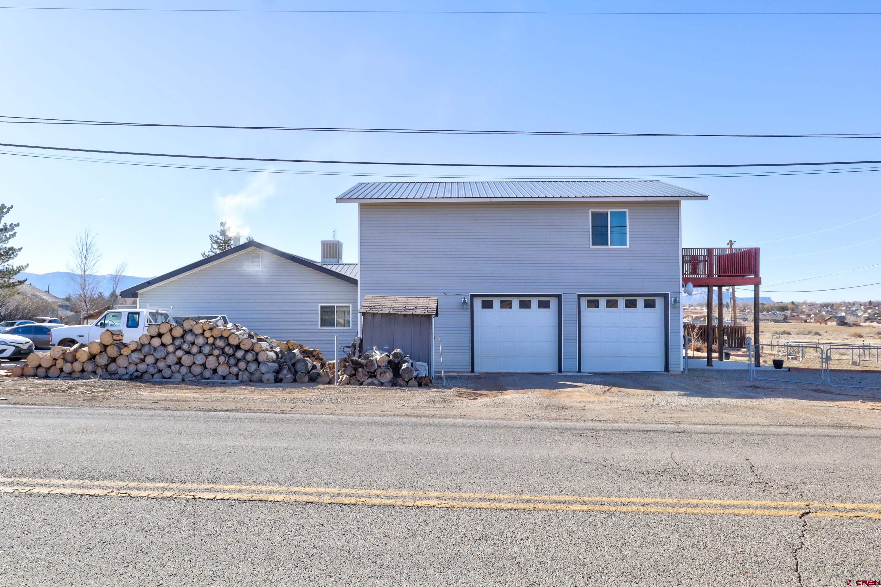 2019 Rolling Road Cortez, CO 81321 - Photo 33 of 35 a view of a house with a yard