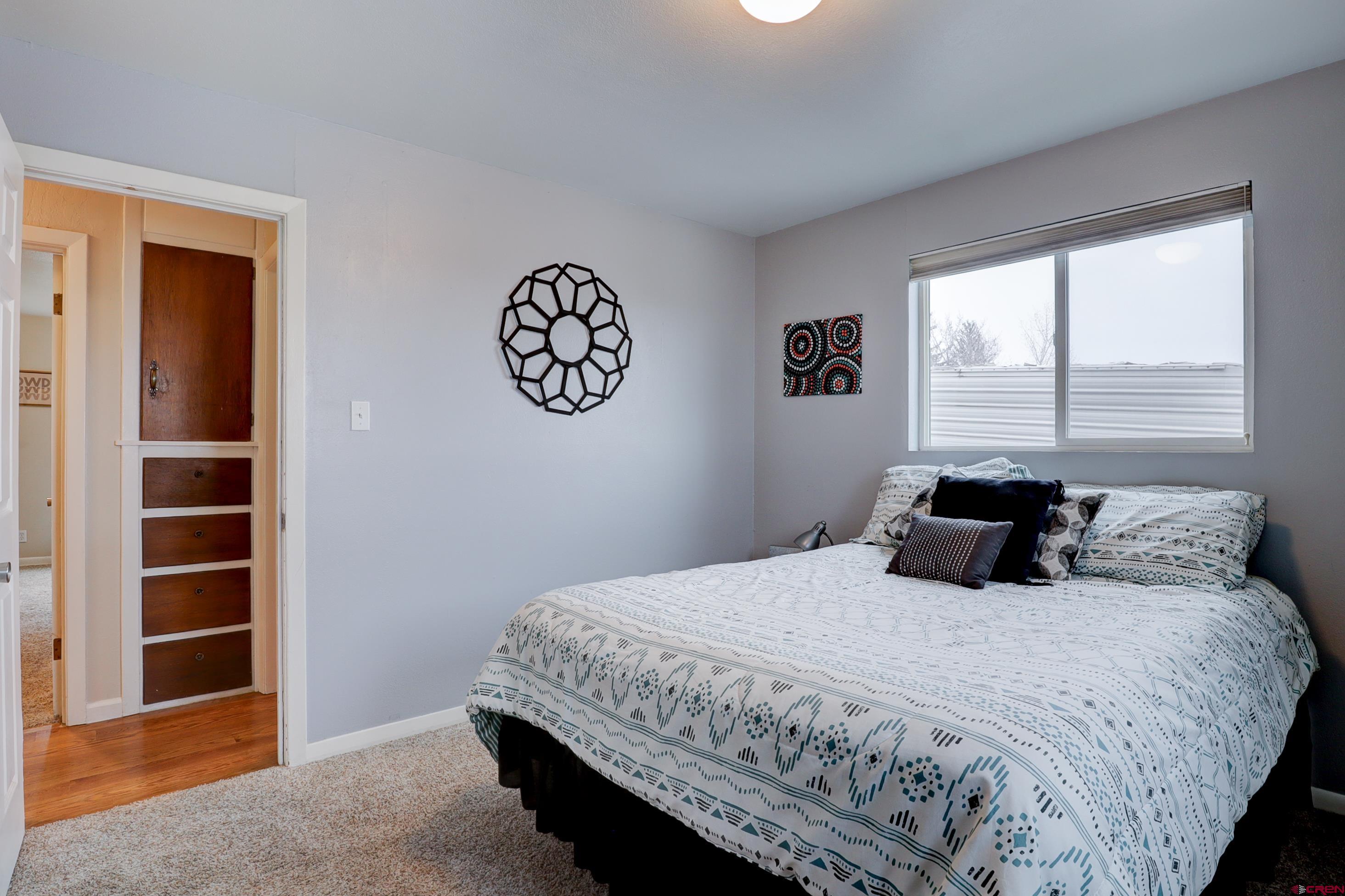 2019 Rolling Road Cortez, CO 81321 - Photo 10 of 35 a bedroom with a bed and a window