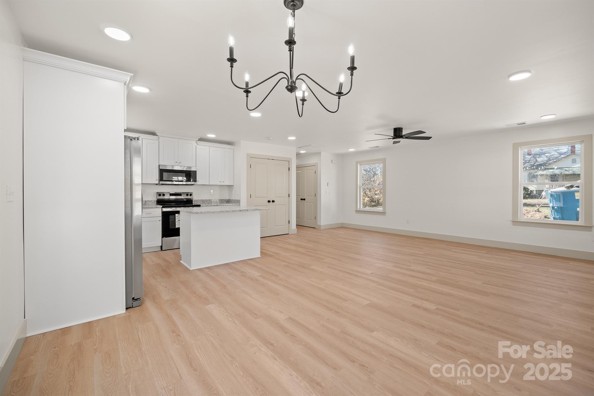 503 West 12th Street Newton, NC 28658 - Photo 11 of 38 a view of a kitchen with a sink stainless steel appliances and cabinets