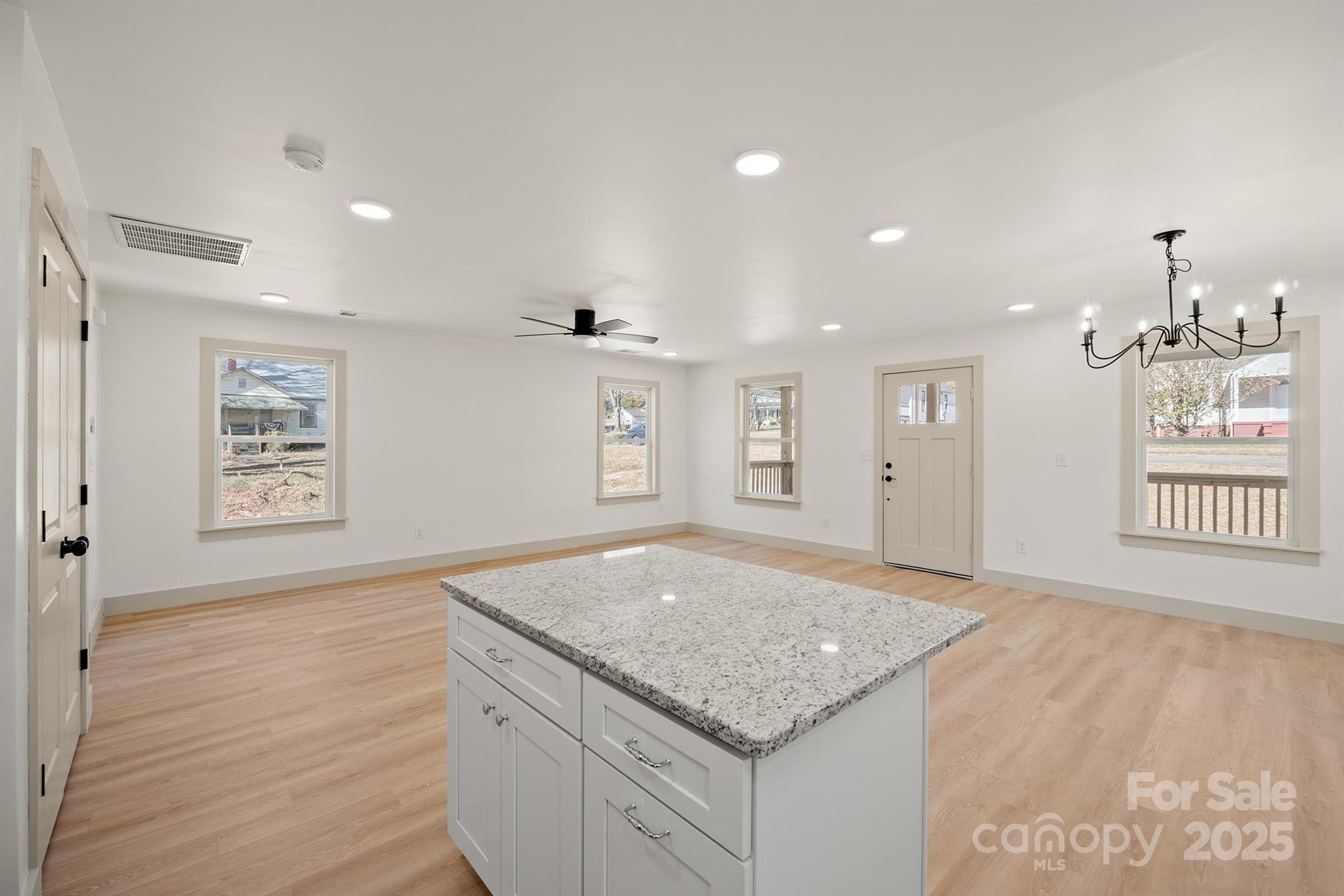 503 West 12th Street Newton, NC 28658 - Photo 18 of 38 an empty room with windows and ceiling fan