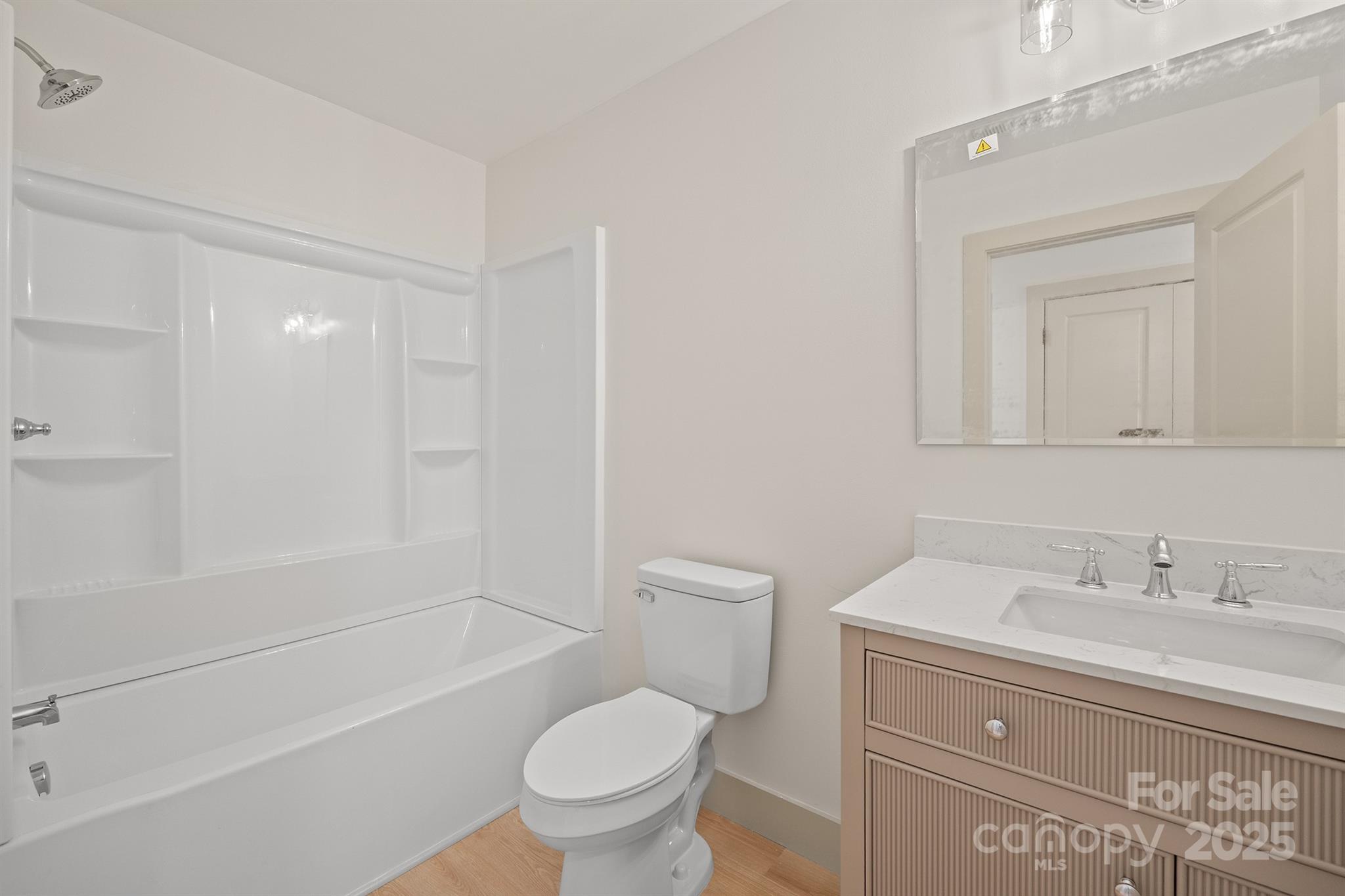 503 West 12th Street Newton, NC 28658 - Photo 23 of 38 a bathroom with a sink a toilet and shower