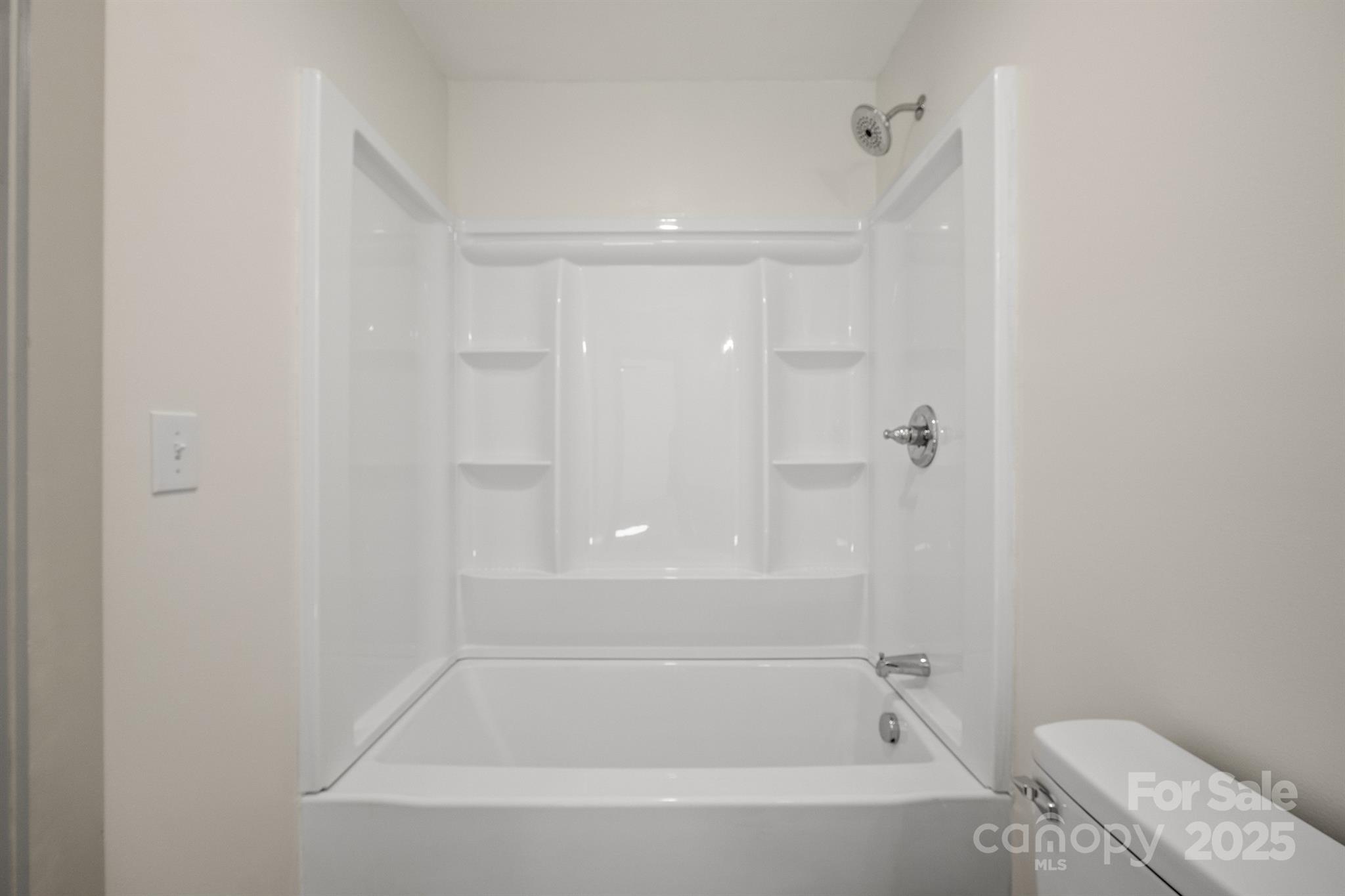 503 West 12th Street Newton, NC 28658 - Photo 35 of 38 a bathroom with a bathtub and toilet