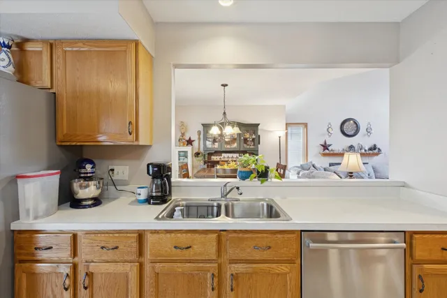 a kitchen with cabinets and window
