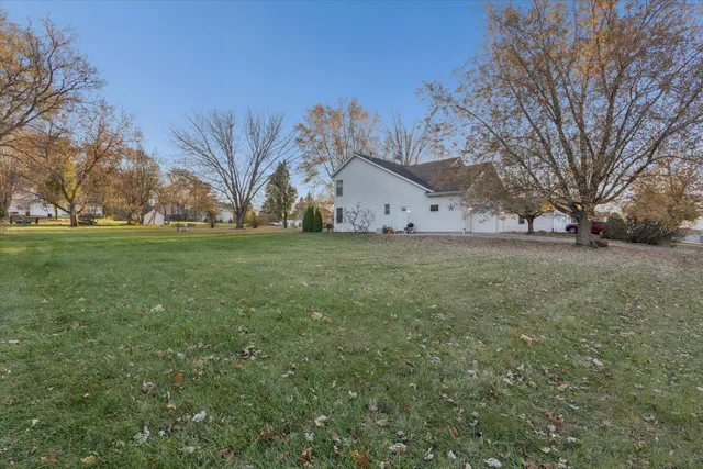 a view of a tree in front of a house