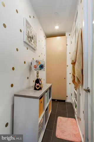 a kitchen with a refrigerator and a stove