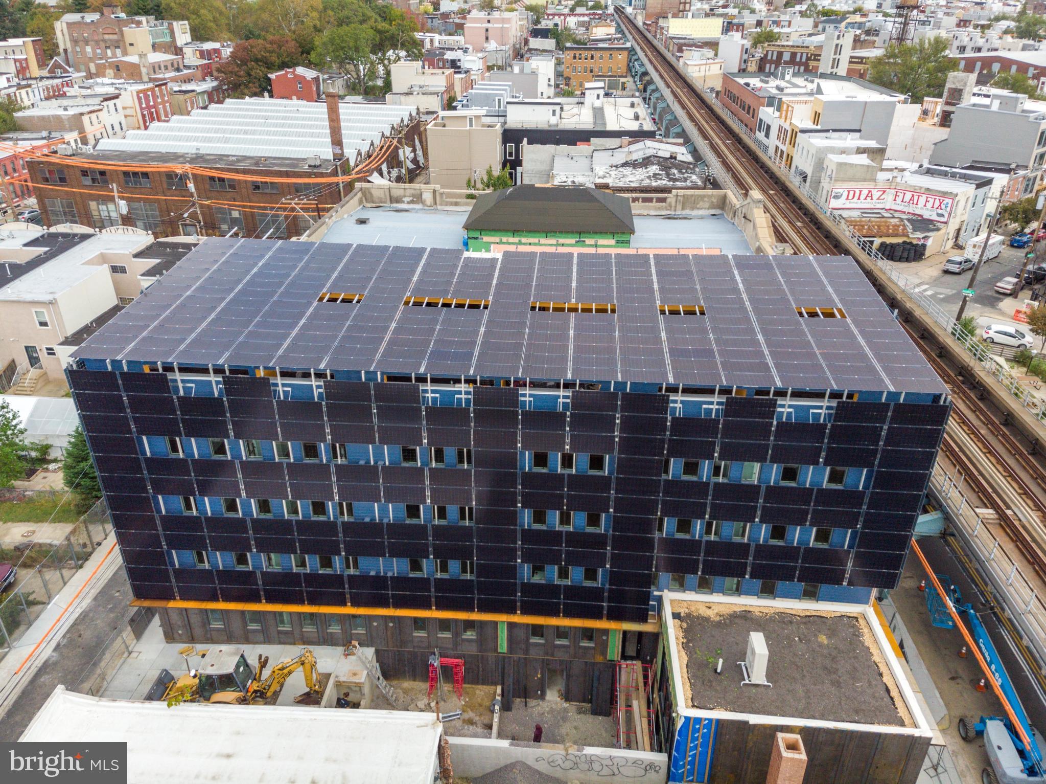 1942 North Front Street, Unit 208 Philadelphia, PA 19122 - Photo 8 of 10 a view of a balcony with wooden floor and city view