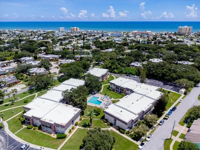 an aerial view of a house with a garden