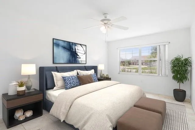 a bedroom with a bed and a window