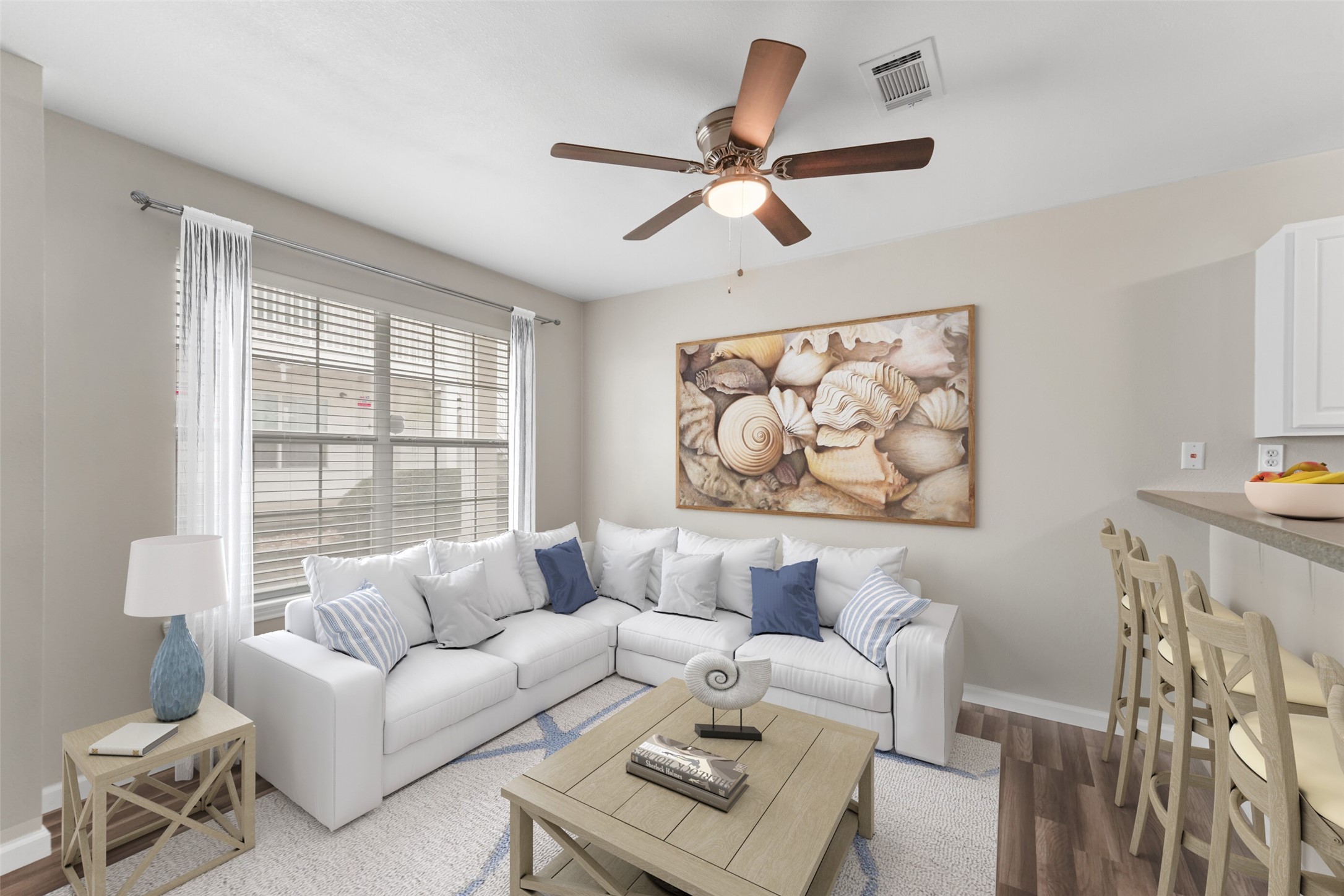 a living room with furniture and a window