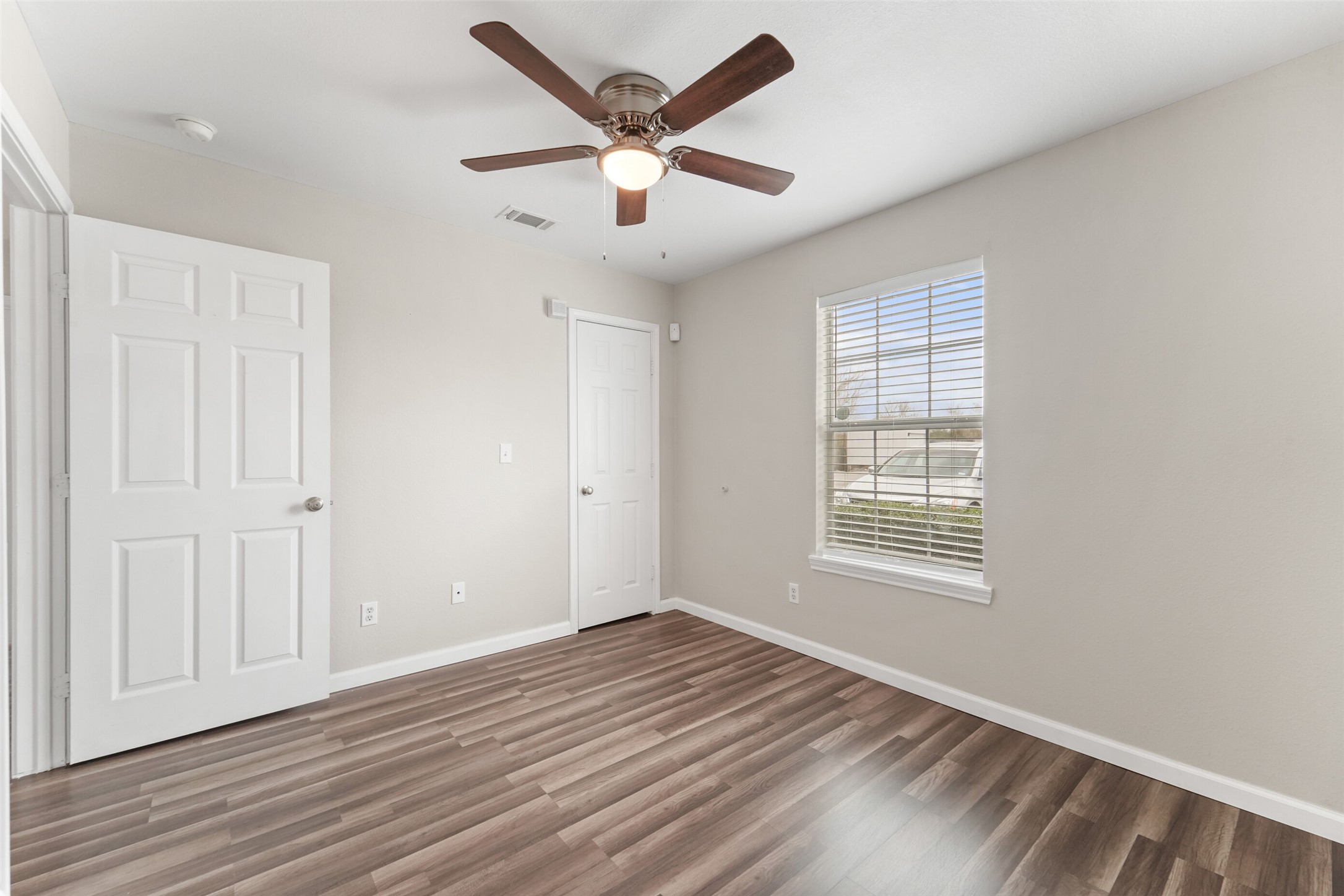44422 Highway 290 Business, Unit 12 Prairie View, TX 77484 - Photo 7 of 13 wooden floor in an empty room with a window