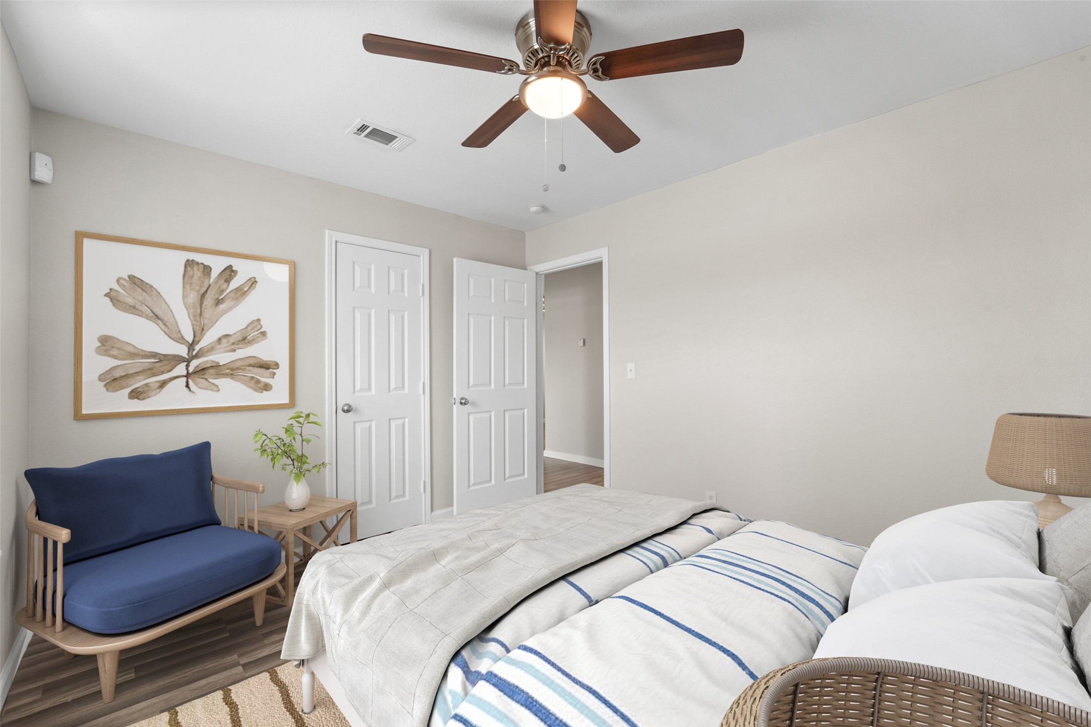 44422 Highway 290 Business, Unit 12 Prairie View, TX 77484 - Photo 9 of 13 a bedroom with a bed chandelier and a couch