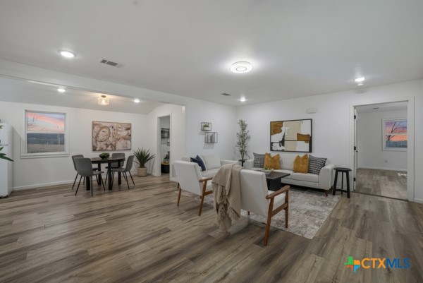 3267 Dairy Road Temple, TX 76501 - Photo 11 of 42 a living room with furniture and wooden floor